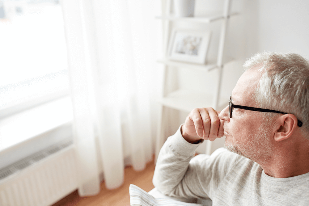 Man thinking and looking out window