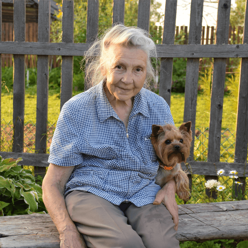 lady on bench with dog